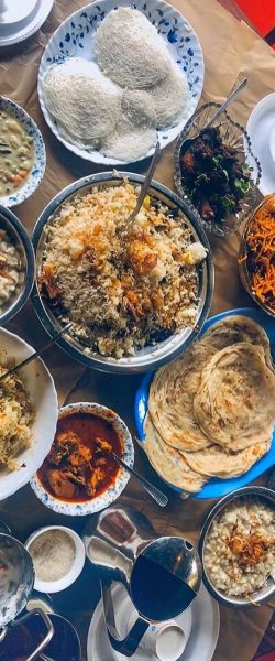 A vertical shot of Indian dishes on the table